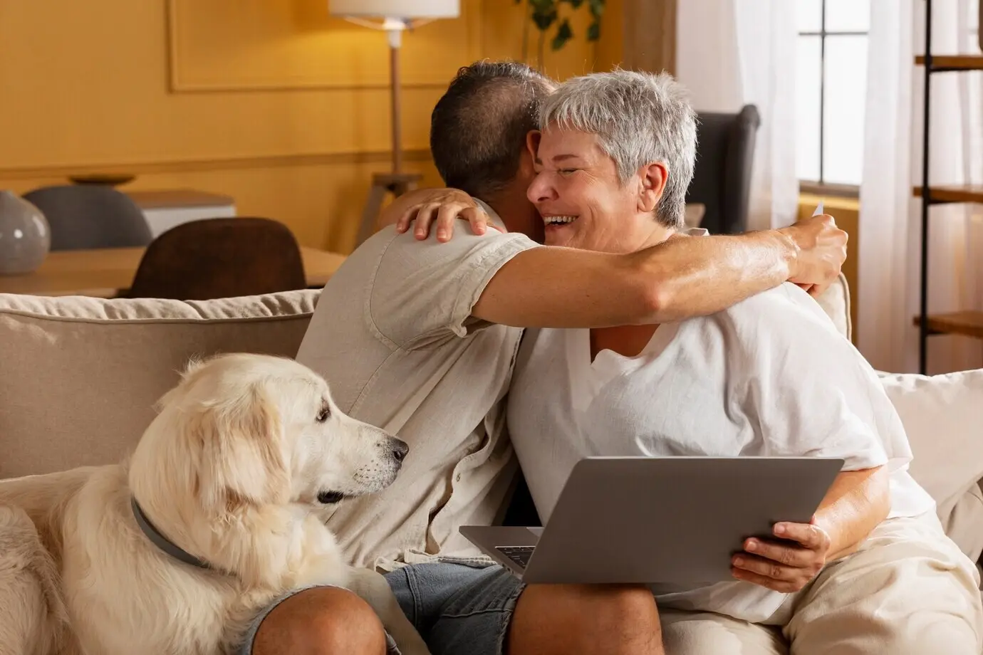 Medium shot of a smiling woman hugging a man